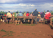 Residents wait for the market to start operations after sunset.