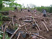 Residents search through the debris of the destroyed house on Tuesday. (Photo / A. Gahene)