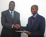 Protais Mitali hands over to Fazil Harelimana after the latter was elected as FPPR Spokesperson. (Photo/ J. Mbanda).