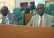 Minister of Labour, Anastase Murekezi (R) and Francois Ngoboka (L) at the senate chambers presenting the Labour Bill on Wednesday. (Photo/ G. Barya).