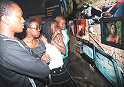 Daystar University Students from Kenya looking at horrific images inside Kigali Genocide Memorial Centre yesterday. (Photo J Mbanda)