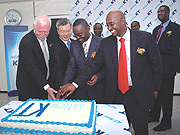 (L-R): RDBu2019s Joe Ritchie, Minister Romain Murenzi,Maeng Soo-ho of KT  and RDB Deputy CEO Nkubito Bakuramutsa cut the cake to launch KT yesterday. (Photo/ J. Mbanda).