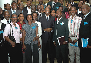 President Kagame poses for a group photo with the u2018Presidentu2019s 100u2019 after their interactive session at Prime Holdings yesterday. (PPU Photo).
