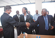 TPS Consult Technical Director Hanif Macci (L) greats Defence Minister Marcel Gatsinzi as Infrastructure Minister Linda Bihire (C) looks on. (Photo J Mbanda).