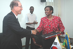 Korean Ambassador to Rwanda Kim Young-Jun (L) shaking hands with Foreign Affairs Minister Rosemary Museminali after signing the agreement. (Photo J Mbanda).