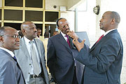 Finance Minister James Musoni (R) chatting with MPs and SSFR Director General Henry Gaperi (L) at perliament yesterday. (Photo GBarya).