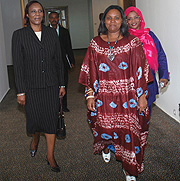 Speaker of Parliament Rose Mukantabana (L) arrives for the FFRP meeting flanked by FFRP Chairperson Specioza Mukandutiye (C) and  Saidati Mukanoheli. (Photo/ J. Mbanda)