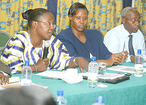 Gender and family Promotion Minister, Jeanne du2019Arc Mujawamariya, with Jane Abatoni of Profemme Twese Hamwe and John Mutamba from UNIFEM at the Validation workshop yesterday. (Photo/G Barya).