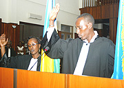 Monique Munyankindi (L) and Frederic Musabwa Kiruhura taking the oath yesterday.(Photo GBarya).