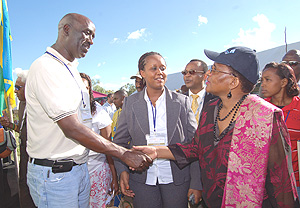 Gervais Mutabazi, a Rwandan tour operator greets Tanzaniau2019s Minister of natural resources and tourism, Shamsa Mwangunga, at the Magereza open grounds in Arusha. (Photo/ G.Mulamira).