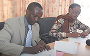 Prosecutor General Martin Ngoga and Transparency Rwandau2019s Immaculee Ingabire signing the MOU. (Photo/ J. Mbanda).