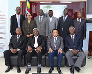 Deputy Auditor General of Rwanda, Obadiah R. Biraro (seated extreme left) poses for a group photograph with his counterparts from partner states of East Africa. Seated third left is the Secretary General of the East African Community, Ambassador Juma Mwap
