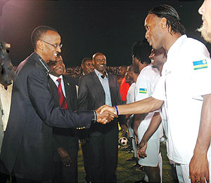 President Kagame greets Ivorian footbal star Didier Drogba during the gala match yesterday (Photo J. Mbanda)