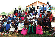 Compassion sponsored children in a group photo with some of their sponsors recently (photo. C.Kwizera)