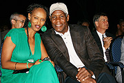 Rwanda Cinema Centreu2019s Jolie Murenzi posing for a photo with International film star and human rights activist Danny Glover