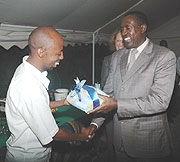 The New Timesu2019 Eugene Mutara receives a prize from Deputy Speaker Jean Damascene Ntawukuliryayo. (Photo/ J. Mbanda)