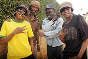 (L-R) Wasswa, VD Frank, Denis and Kato pose for a group photo at The New Timesu2019 Head offices in Kacyiru. (Photo by J. Mbanda).