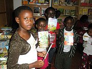 Children hold books during the International Childrenu2019s Book Day celebrations