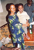 Uwera Uwase carrying her first born Sonia