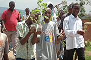 Rwandan youth carry trees for planting during the Environment Week (File Photo)