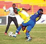 Atracou2019s Ugandan defender Godfrey Katerega protects the ball against a KCC striker in yesterdayu2019s quarterfinal clash. The Rwandan champions stunned their Ugandan counterparts 4-0. (Photo / M. Ayuro)