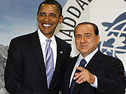 U.S. President Barack Obama is greeted by Italian Prime Minister Silvio Berlusconi before a working lunch session of G-8 leaders at the summit in Lu2019Aquila, Italy
