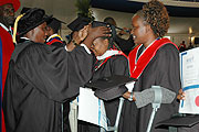 Education Minister Daphrose Gahakwa confers on  a degree to a graduate at KISTs