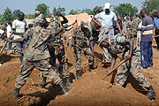 RDF soldiers working on a site in Kicukiro District during the Army Week.