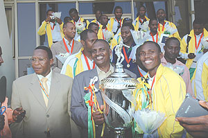 YES WE CAN: Victorious Atraco received a herosu2019 welcome on their arrival at Kigali International Airport yesterday. Atraco vice president Issa Ngezi (C), Sports minister Joseph Habineza and Ferwafa vice president Vedaste Kayiranga, team captain Jean Shyak