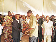 Prime Minister Bernard Makuza (R) greets Huye Mayor Francois Uhagaze after opening the 7th Itorero. (Photo/ P. Ntambara)