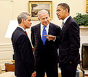 U.S. President Barack Obama, right, talks with Israeli Prime Minister Benjamin Netanyahu, center, and White House chief of staff Rahm Emanuel in the Oval Office
