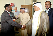 (4-WELCOME; State Minister for Energy Albert Butare (L) greets Essa Abdulla Al Noaimi the head of the delegation at the latter's office on Wednesday. (Photo J. Mbanda)
