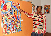 Nkurunziza shows off one of his finished work at Torero Cafe