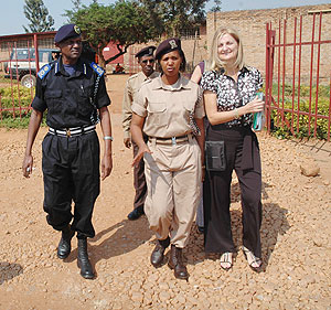 Joanna Pauline  from SC-SL (R) , Kigali Central Prison Director Dativa Ngaboyisonga (C) and Steven Balinda tour Kigali Central Prison. (Photo J Mbanda)