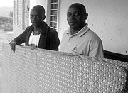 beneficiaries showing off items  donated by World Relief