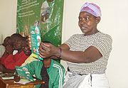 A Nyanza resident taking a closer look at a Hirwa brochure during its  launch (Photo D.Sabiiti)