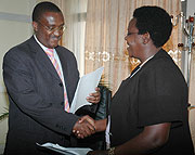 Former State Minister for Primary and Secondary Education Theonest Mutsindashyaka handing over to Education Minister Daphrose Gahakwa on Friday. They are now both out.