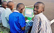 Rwandan children discovering the world through their computers