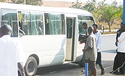Passengers entering a city center bound bus. The price changes have confused many.