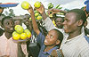 Revellers buying fruits at a Kigali market (File Photo)