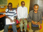 From left -Right Jean Mugiraneza reads with his fingers,Teophile Havugiyaremye listens while Innocent Vuguziga types on a computer(Photo L.Nakayima)