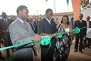 Premier Bernard Makuza (C) flanked by EAC Affairs Minister Monique Mukaruliza (R) and Private Sector Federation Chairman Robert Bayigamba, officially opens the 12th Expo. (Photo J Mbanda)