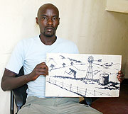 John Taouss Tuyisambe exposes one of his art paintings 