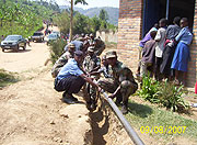 RDF 408 Brigade soldiers and  National Police officers lay down water pipes to provide clean water to residents of Tumba Sector in Rulindo District (Photo A.Gahene).