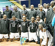 APR players and their coach Jean Luc Ndayikengurukiye (Standing far left with cap) enjoy a group photo after winning the Genocide Memorial tournament. (File photo)