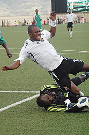 Striker Ndjoli Bokungu brought to the ground by Gor Mahia goalie Jerry Onyango during a Confederations Cup return leg tie in Kigali early this year.