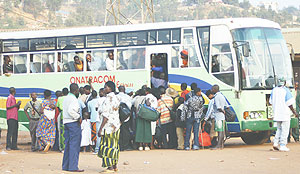 BACK TO SCHOOL:  Students hustle to enter an ONATRACOM bus as they get back to school yesterday.(Photo/F Goodman)