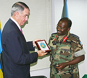 Lt. Gen. Charles Muhire presents a gift  to General Joe Ashy (Photo F Goodman).