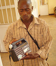 Alfred Baziruwihoreye, from Mataba admires his radio.
