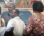Munyanganizi Bikoro  (in suit) with family members and friends outside court. (Photo J Mbanda).